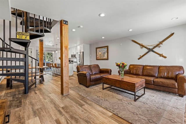 112 Illinois Gulch Rd Unit 6, Breckenridge, CO 80424 - living room with stairs, wood finished floors, and recessed lighting
