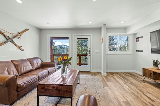 112 Illinois Gulch Rd Unit 6, Breckenridge, CO 80424 - living room with recessed lighting, light wood-style floors, and plenty of natural light