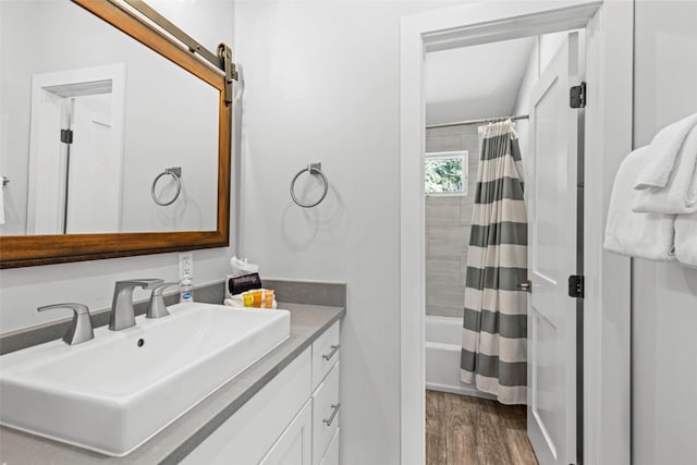 112 Illinois Gulch Rd Unit 6, Breckenridge, CO 80424 - bathroom featuring wood finished floors, vanity, and shower / tub combo with curtain