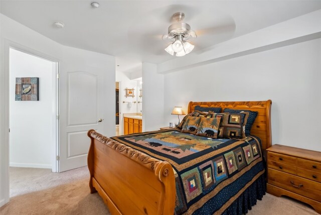283 Pelican Cir Unit 1703, Breckenridge, CO 80424 - bedroom with baseboards, connected bathroom, a ceiling fan, and light colored carpet