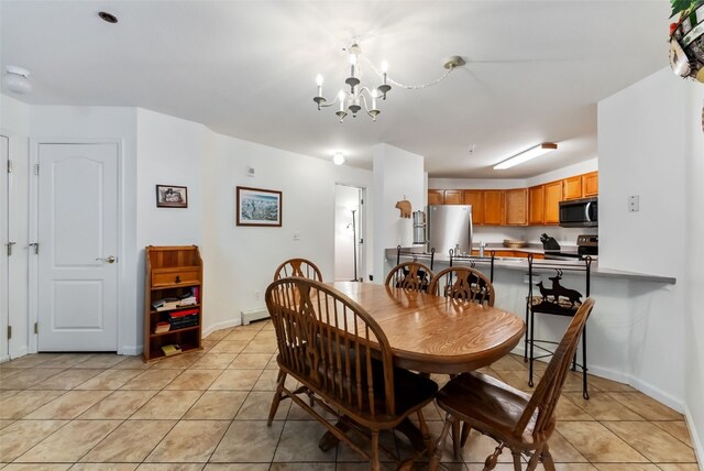 283 Pelican Cir Unit 1703, Breckenridge, CO 80424 - dining area featuring baseboards, a chandelier, and light tile patterned flooring