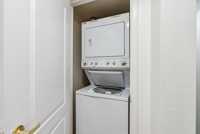 283 Pelican Cir Unit 1703, Breckenridge, CO 80424 - washroom with stacked washing maching and dryer and laundry area