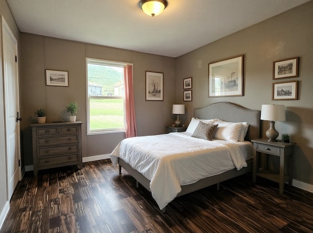 21762 4th Ave, Phippsburg, CO 80469 - bedroom featuring dark wood-style floors and baseboards