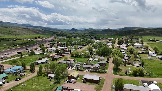 21762 4th Ave, Phippsburg, CO 80469 - aerial view of property and surrounding area with mountains and nearby suburban area