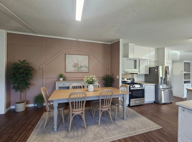 21762 4th Ave, Phippsburg, CO 80469 - dining space with dark wood-style flooring and ornamental molding