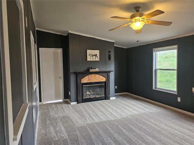21762 4th Ave, Phippsburg, CO 80469 - unfurnished living room featuring a glass covered fireplace, carpet, crown molding, and a ceiling fan