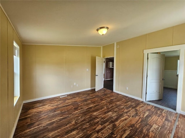 21762 4th Ave, Phippsburg, CO 80469 - unfurnished bedroom featuring wood finished floors, a decorative wall, and ornamental molding