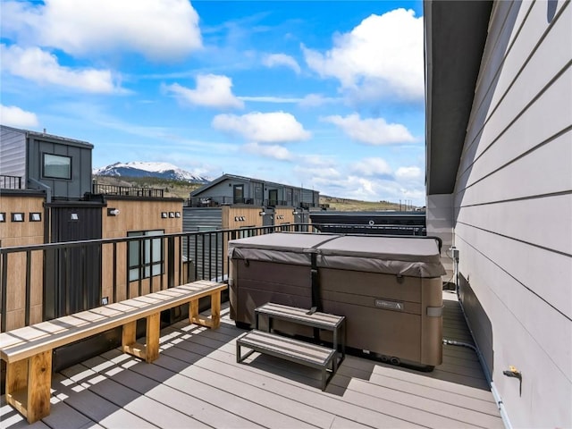 62 W 3rd St Unit D, Silverthorne, CO 80498 - wooden deck featuring a hot tub and a mountain view