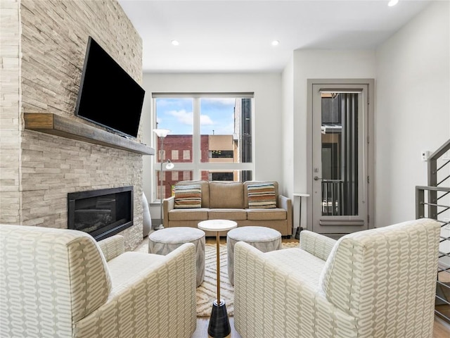 62 W 3rd St Unit D, Silverthorne, CO 80498 - living room featuring wood finished floors, a stone fireplace, and recessed lighting