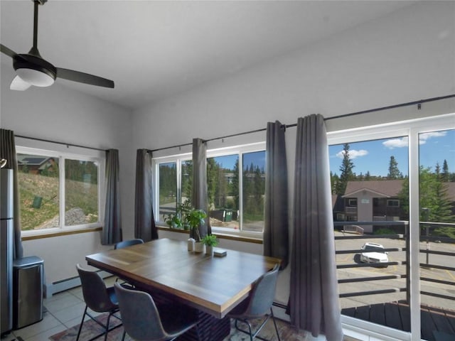 9876 Ryan Gulch Rd Unit 106, Silverthorne, CO 80498 - tiled dining space featuring a baseboard heating unit and ceiling fan