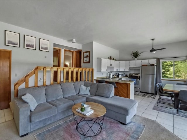 9876 Ryan Gulch Rd Unit 106, Silverthorne, CO 80498 - living area with light tile patterned floors and ceiling fan