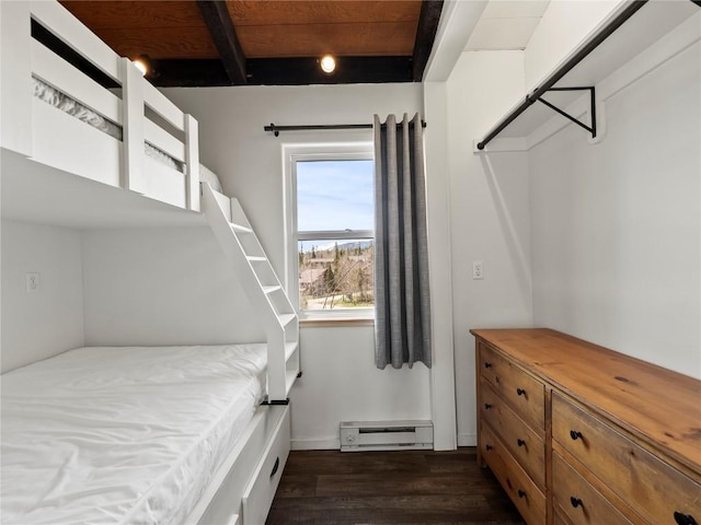 8012 Ryan Gulch Rd Unit B3, Silverthorne, CO 80498 - bedroom with a baseboard radiator, dark wood-style floors, beamed ceiling, and baseboards