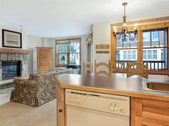 100 Dercum Sq Unit 8389, Keystone, CO 80435 - kitchen with dishwasher, open floor plan, a chandelier, carpet flooring, and decorative light fixtures