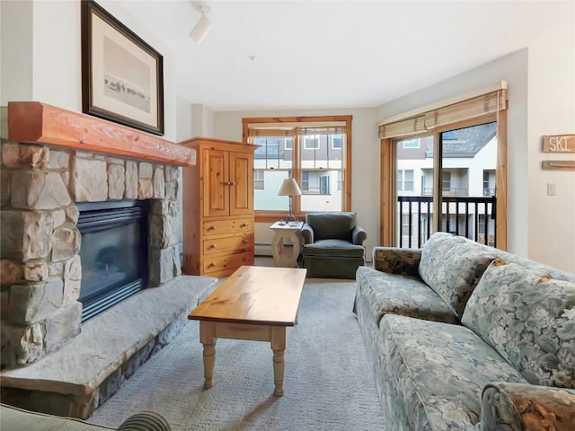 100 Dercum Sq Unit 8389, Keystone, CO 80435 - living area with light carpet and a stone fireplace
