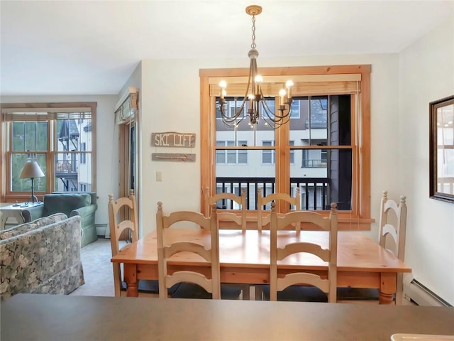 100 Dercum Sq Unit 8389, Keystone, CO 80435 - dining space featuring a baseboard heating unit and a chandelier