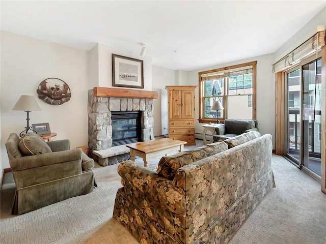 100 Dercum Sq Unit 8389, Keystone, CO 80435 - living area featuring light carpet and a stone fireplace