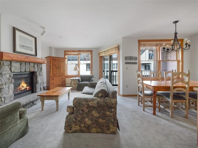 100 Dercum Sq Unit 8389, Keystone, CO 80435 - living room featuring a chandelier, a fireplace, and light colored carpet