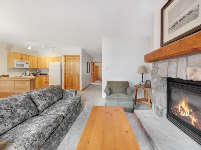 100 Dercum Sq Unit 8389, Keystone, CO 80435 - living area featuring light carpet and a stone fireplace