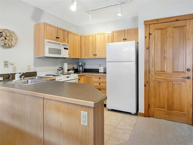 100 Dercum Sq Unit 8389, Keystone, CO 80435 - kitchen with white appliances, light brown cabinetry, a peninsula, and rail lighting