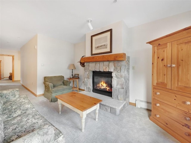 100 Dercum Sq Unit 8389, Keystone, CO 80435 - living area featuring baseboard heating, light colored carpet, and a stone fireplace