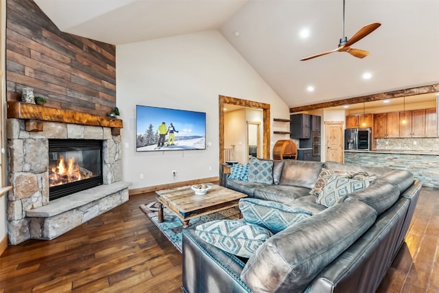 52 Buckskin Ln, Silverthorne, CO 80498 - living room with high vaulted ceiling, hardwood / wood-style flooring, ceiling fan, and a stone fireplace
