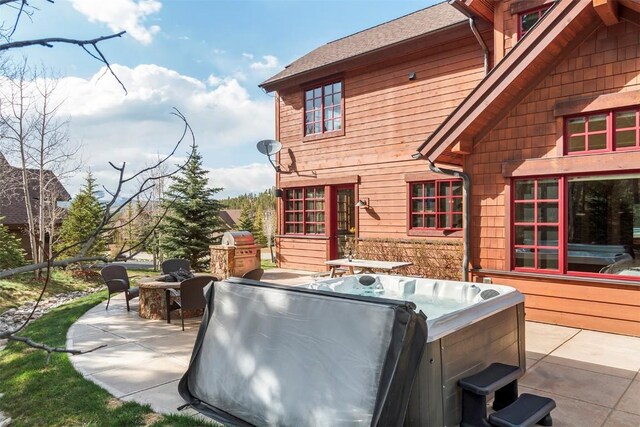 168 Corkscrew Dr, Breckenridge, CO 80424 - view of patio with a hot tub and an outdoor fire pit