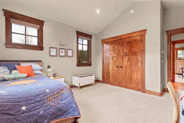 168 Corkscrew Dr, Breckenridge, CO 80424 - bedroom featuring baseboards, multiple windows, vaulted ceiling, light carpet, and recessed lighting