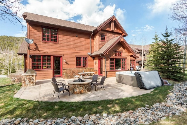 168 Corkscrew Dr, Breckenridge, CO 80424 - rear view of house featuring a patio, a hot tub, and roof with shingles