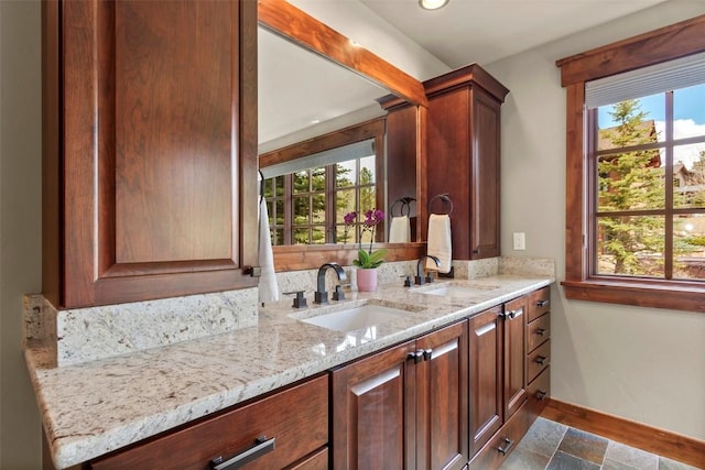 168 Corkscrew Dr, Breckenridge, CO 80424 - bathroom with baseboards, double vanity, plenty of natural light, and recessed lighting