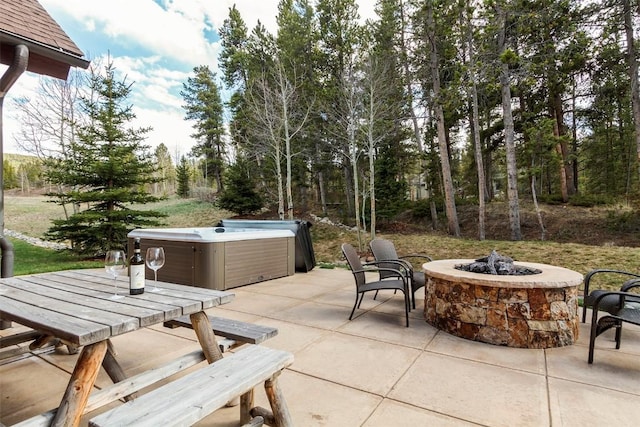 168 Corkscrew Dr, Breckenridge, CO 80424 - view of patio / terrace with a hot tub, an outdoor fire pit, and outdoor dining area