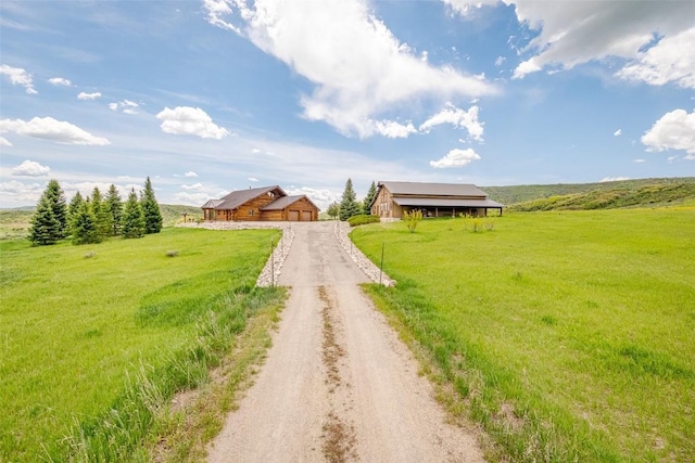 23125 Fawn Creek Rd, Steamboat Springs, CO 80487 - view of dirt / gravel driveway featuring a view of countryside