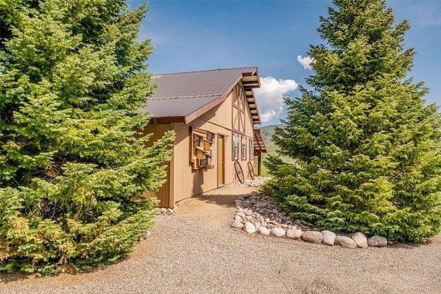 23125 Fawn Creek Rd, Steamboat Springs, CO 80487 - view of side of home featuring metal roof and an outbuilding