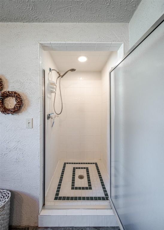 23125 Fawn Creek Rd, Steamboat Springs, CO 80487 - bathroom with a stall shower and recessed lighting