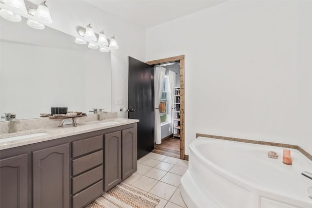 21775 4th Ave, Phippsburg, CO 80469 - bathroom featuring tile patterned flooring, a bath, and double vanity