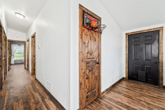 21775 4th Ave, Phippsburg, CO 80469 - corridor with dark wood-style flooring, lofted ceiling, and baseboards