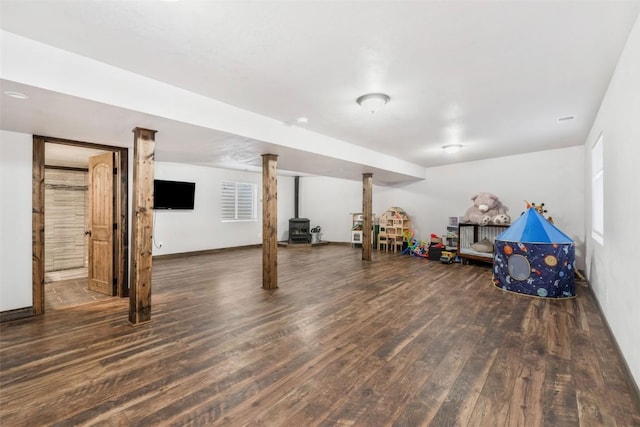 21775 4th Ave, Phippsburg, CO 80469 - basement featuring wood finished floors, a wood stove, and baseboards
