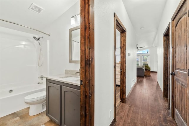 21775 4th Ave, Phippsburg, CO 80469 - full bath featuring toilet, shower / washtub combination, vanity, and wood finished floors