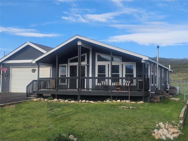 21775 4th Ave, Phippsburg, CO 80469 - view of front facade featuring a garage and gravel driveway