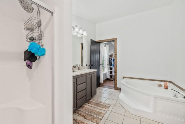 21775 4th Ave, Phippsburg, CO 80469 - full bathroom with a shower stall, tile patterned flooring, a bath, and vanity