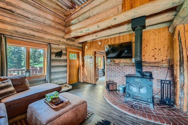 922 Braddock Dr, Breckenridge, CO 80424 - living area featuring a wood stove, wood finished floors, and rustic walls