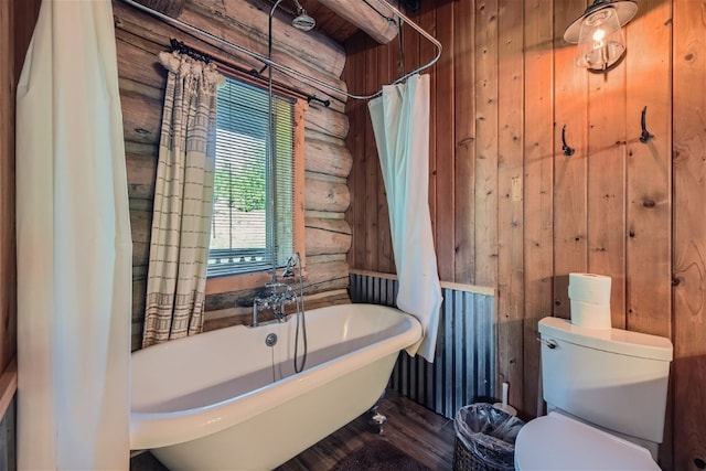 922 Braddock Dr, Breckenridge, CO 80424 - bathroom featuring a freestanding tub, wood walls, and wood finished floors