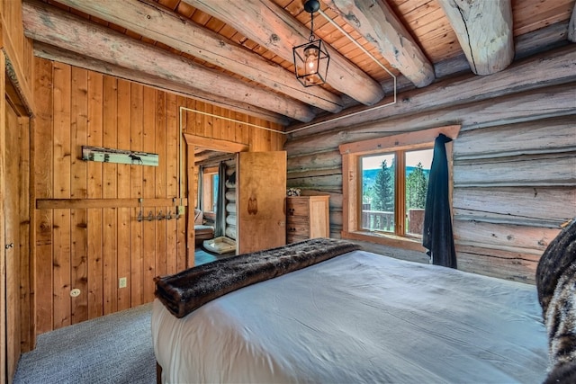 922 Braddock Dr, Breckenridge, CO 80424 - bedroom with a wood ceiling with exposed beams, wooden walls, and carpet