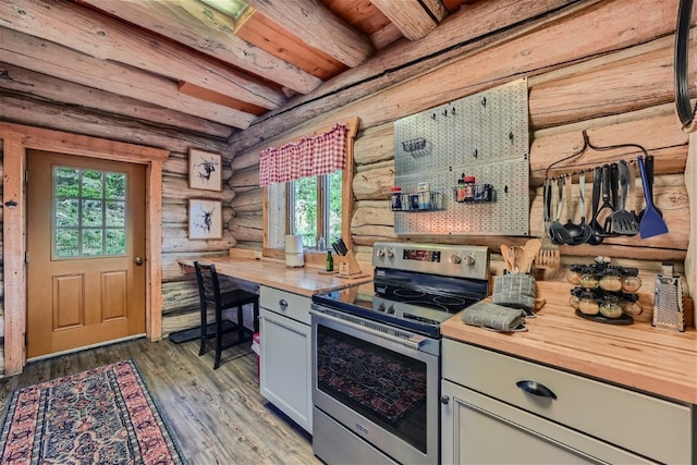 922 Braddock Dr, Breckenridge, CO 80424 - kitchen featuring electric stove, butcher block countertops, plenty of natural light, rustic walls, and wood finished floors
