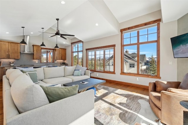 481 W Main St Unit A201, Frisco, CO 80443 - living area featuring wood finished floors, ceiling fan, baseboards, lofted ceiling, and recessed lighting