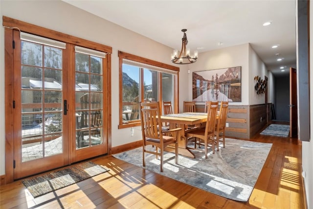 481 W Main St Unit A201, Frisco, CO 80443 - dining room featuring french doors, baseboards, recessed lighting, a notable chandelier, and hardwood / wood-style floors
