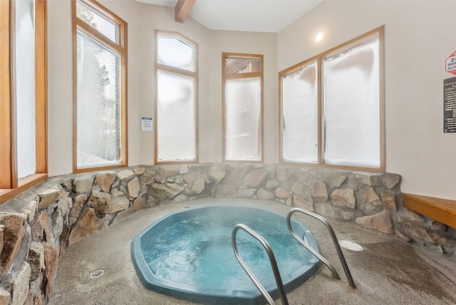 view of pool with an indoor hot tub