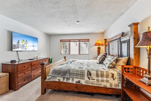 bedroom featuring light colored carpet and a textured ceiling