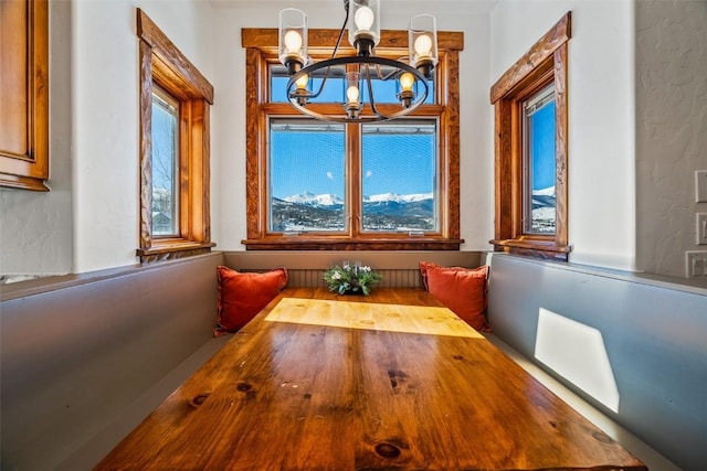 unfurnished dining area with breakfast area and a notable chandelier