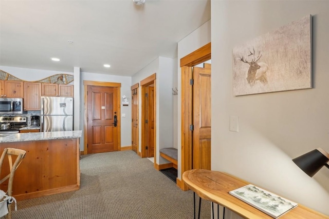 53 Hunki Dori Ct Unit 8806, Keystone, CO 80435 - kitchen with recessed lighting, light stone counters, light carpet, decorative backsplash, and appliances with stainless steel finishes