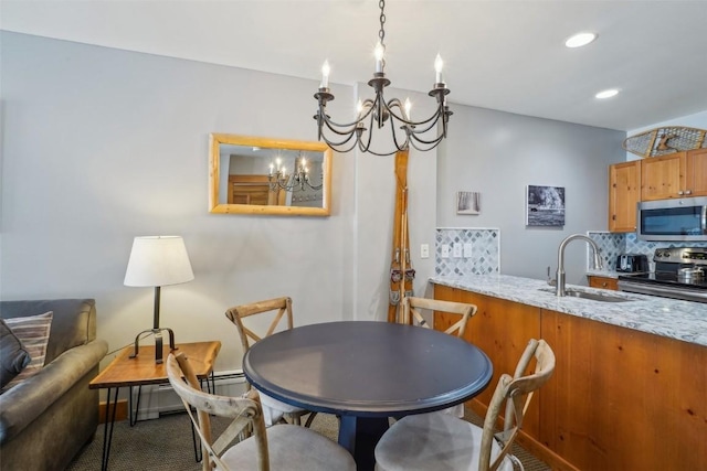 53 Hunki Dori Ct Unit 8806, Keystone, CO 80435 - dining space featuring recessed lighting, carpet flooring, and a notable chandelier